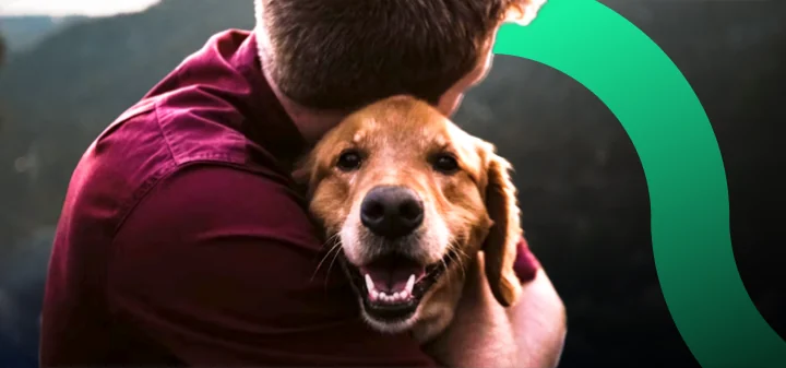 Happy dog with its owner